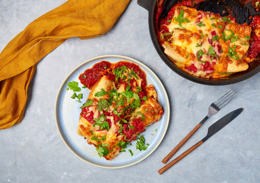Mushroom and zucchini enchilada with melted cheddar and tomato salsa