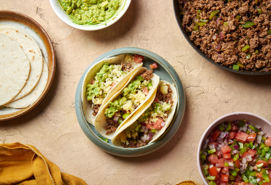 Beef and capsicum tacos with avocado, cheddar and salsa