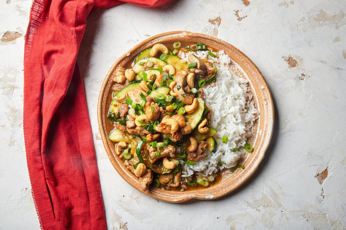 Guangdong stir fry chicken with zucchini and cashews on jasmine rice