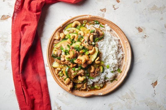 Guangdong stir fry chicken with zucchini and cashews on jasmine rice