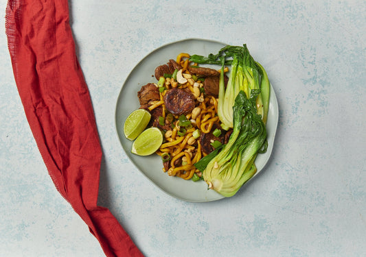 Honey ginger beef hokkien noodles with bok choy, cashews and lime