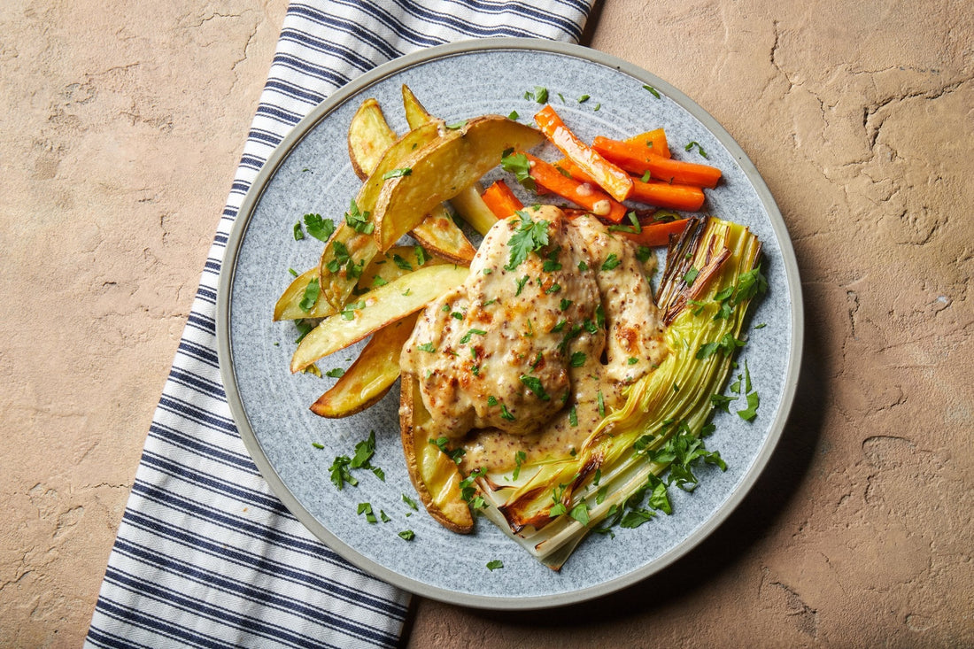 Chicken Welsh rarebit with roasted leek, carrot and potato wedges