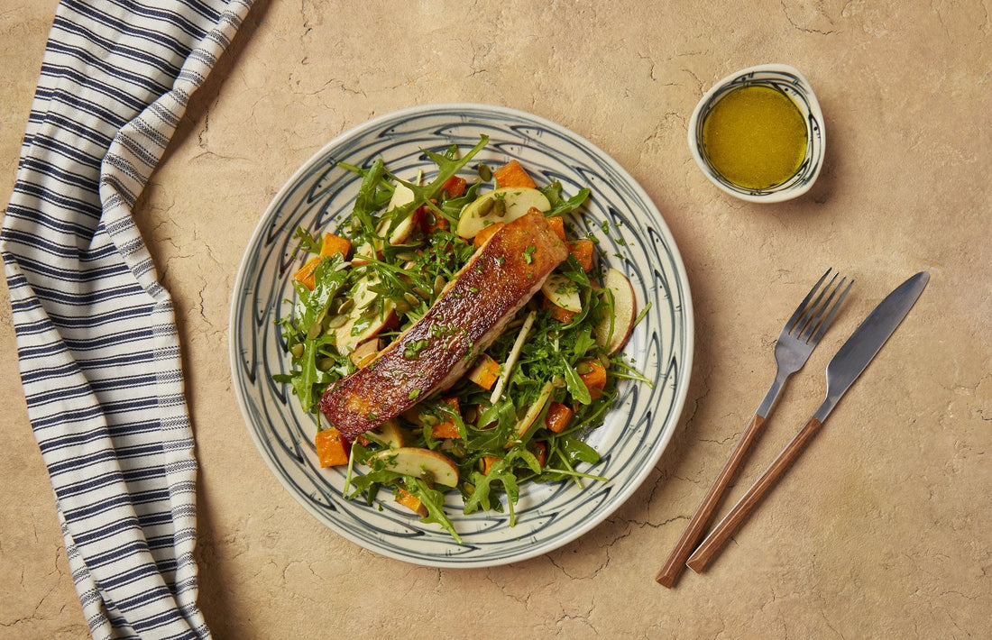 Crispy skin salmon on roasted pumpkin, apple and rocket salad