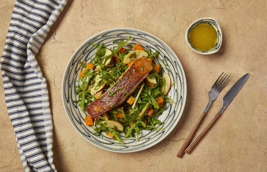 Crispy skin salmon on roasted pumpkin, apple and rocket salad