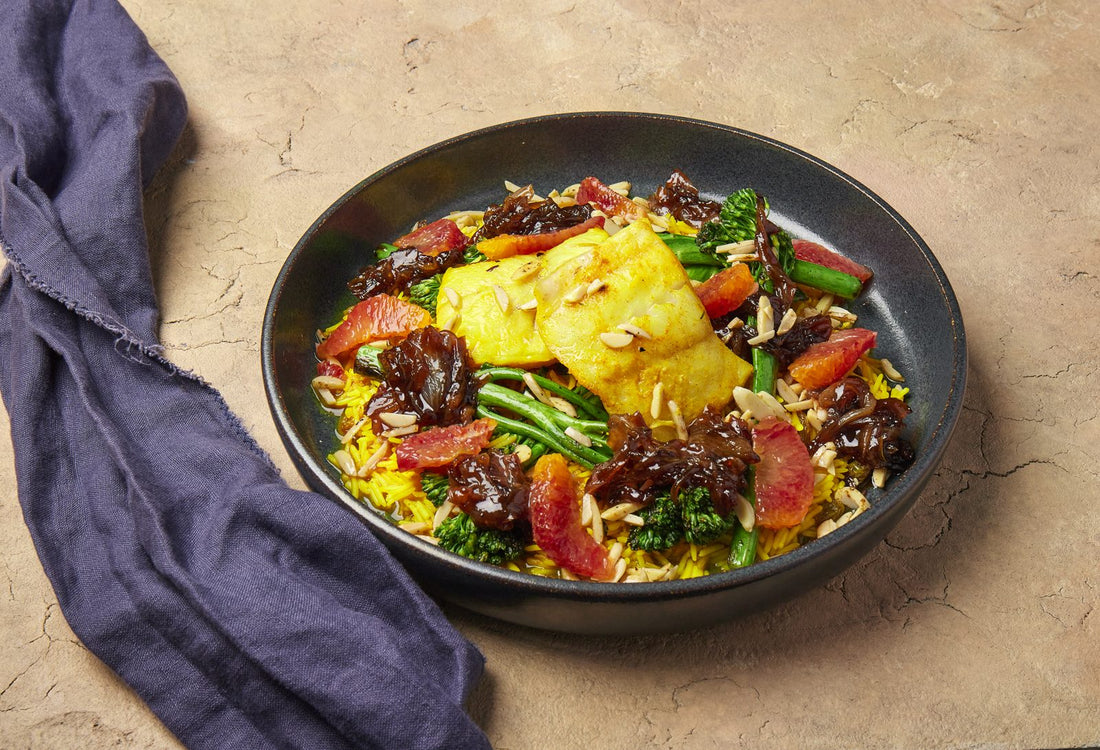 Sayadieh baked fish over turmeric rice pilau with orange and caramelised onion