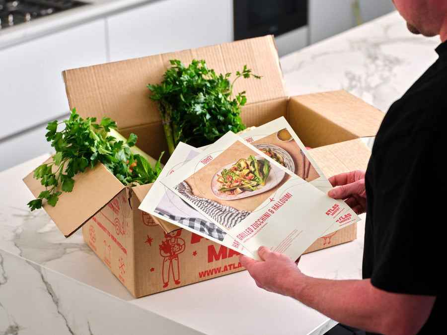 Unpacking an Atlas Market box in the kitchen