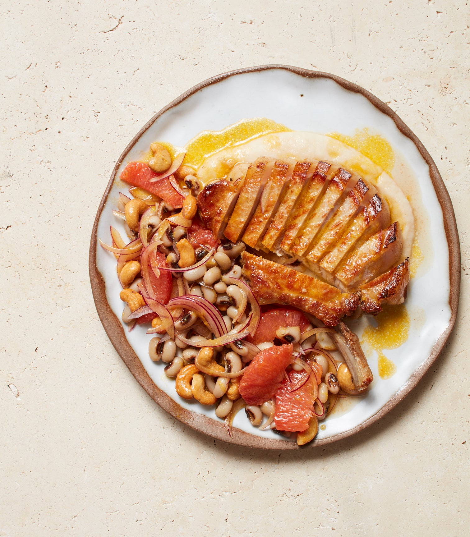 Grilled Pork Chops with Black-eyed Peas, Grapefruit and Cashew Nuts